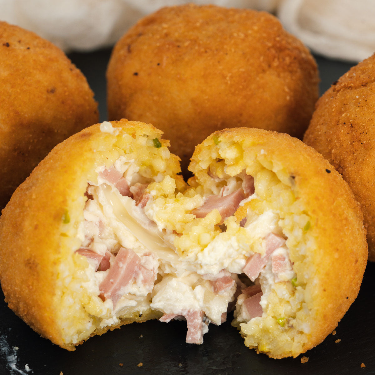 Arancini with lemon, mortadella and pistachio | SicilyAddict